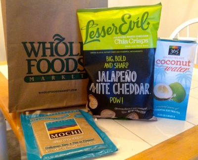Package of Mochi, Jalapeño and White Cheddar Chia Crisps, and Coconut Water